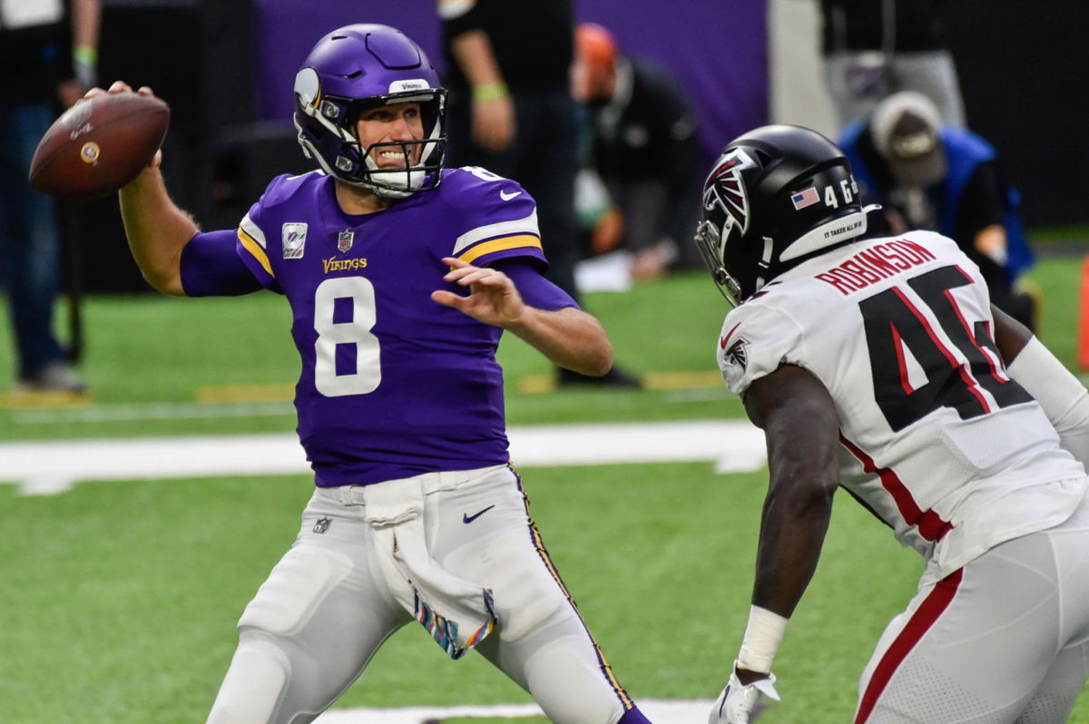 Minnesota Vikings quarterback Kirk Cousins attempts to make a pass against Atlanta Falcons on Sunday.
