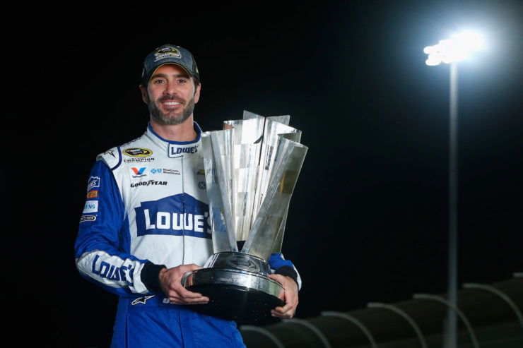 Seven-time NASCAR Cup Series champion Jimmie Johnson holds his trophy