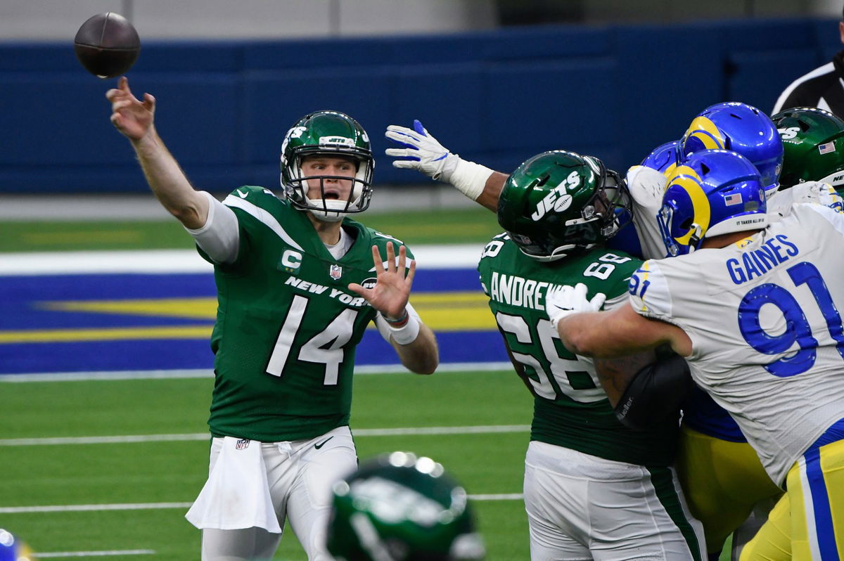 New York Jets quarterback Sam Darnold attempts to make a throw against Los Angeles Rams.