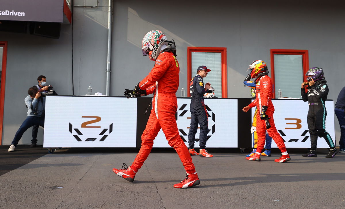 Carlos Sainz walks back to the paddock after the race