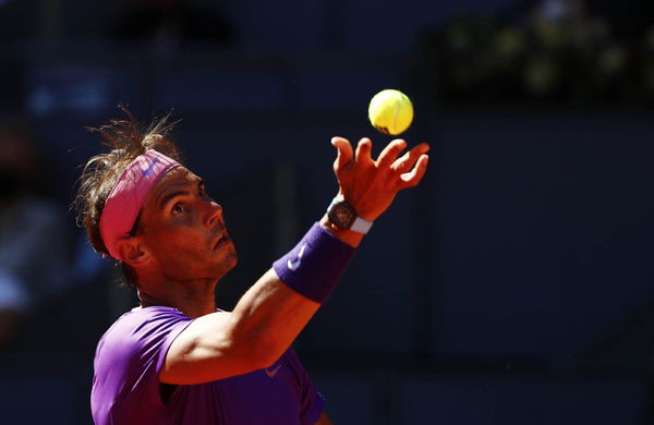 Why Rafael Nadal Hits His Racquet on His Shoes Before Serving on Clay? -  EssentiallySports