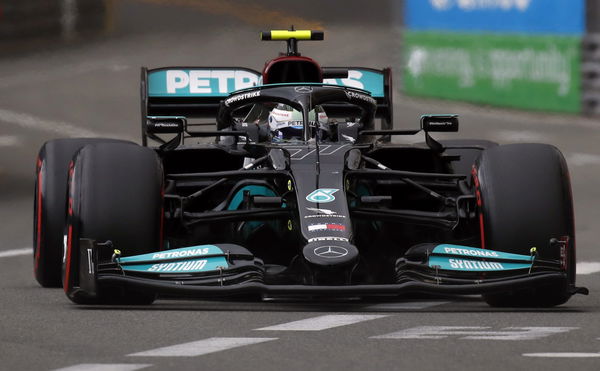 Watch Mercedes Finally Succeed In Separating Bottas W12 Tire From Jammed Wheel Nut Essentiallysports