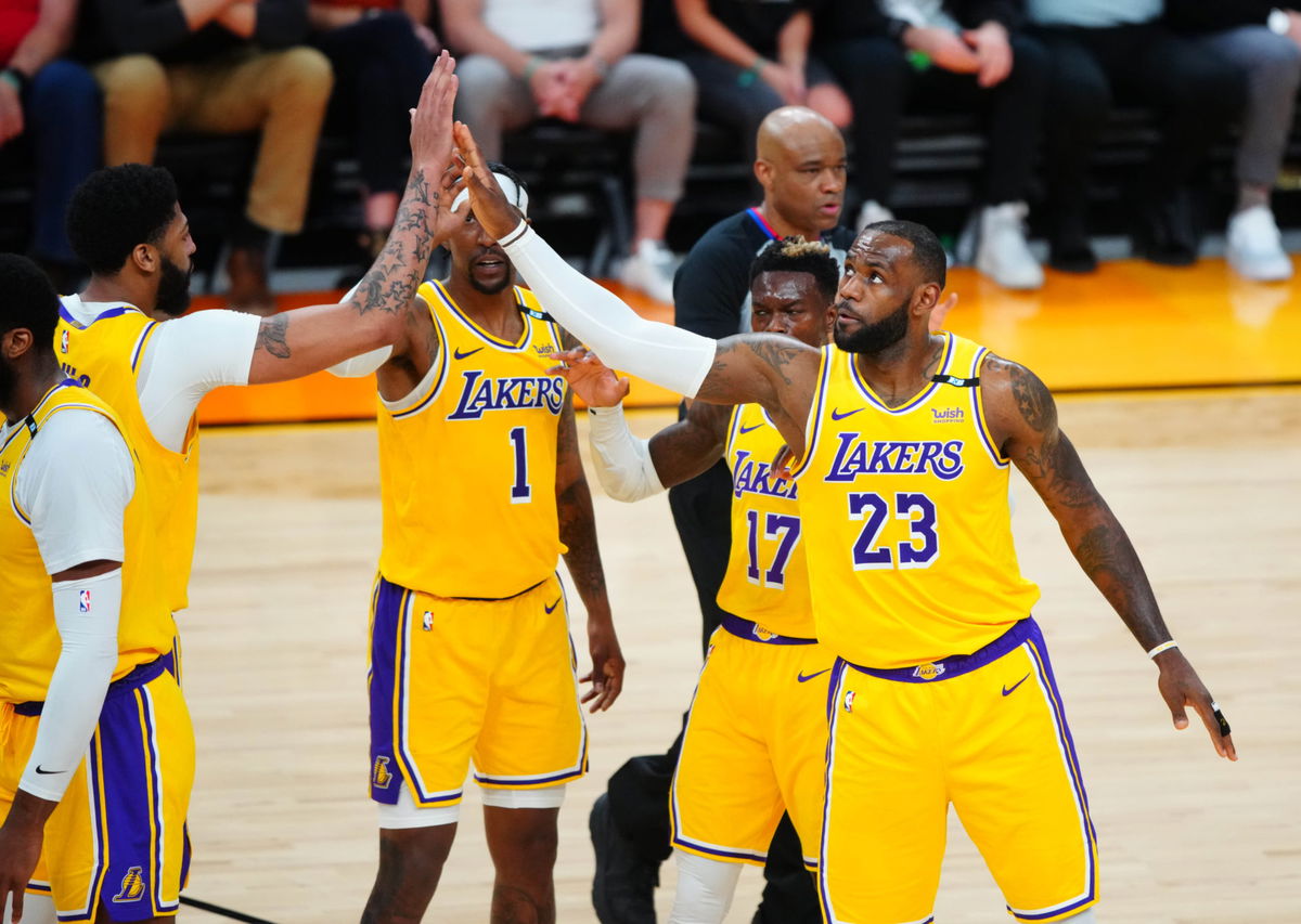 Los Angeles Lakers forward LeBron James (23) celebrates with teammates