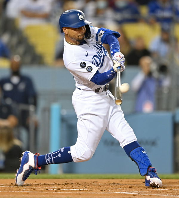 Los Angeles Dodgers right fielder Mookie Betts (50) smiles and flashes the  Shaka sign as he rounds the bases after hitting a home run during the  third inning of a MLB baseball