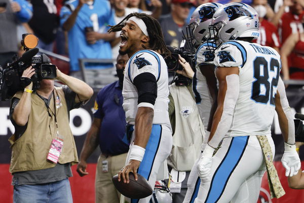 Welcoming back Carolina Panthers quarterback Cam Newton a Panthers fan  holds up a sign prior to an NFL football game against the Arizona Cardinals  Sunday, Nov. 14, 2021, in Glendale, Ariz. The