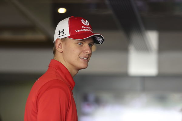 Mick Schumacher of Germany and Ferrari  in the Paddock