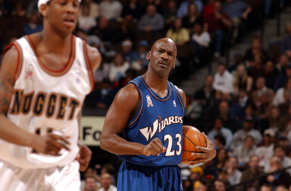 Wizards star Michael Jordan watches Denver&#8217;s Kenny Satterfield during the first period of last nights game between the Denver Nuggets and the Washington Wizards. (Craig F. Walker/The Denver Post)