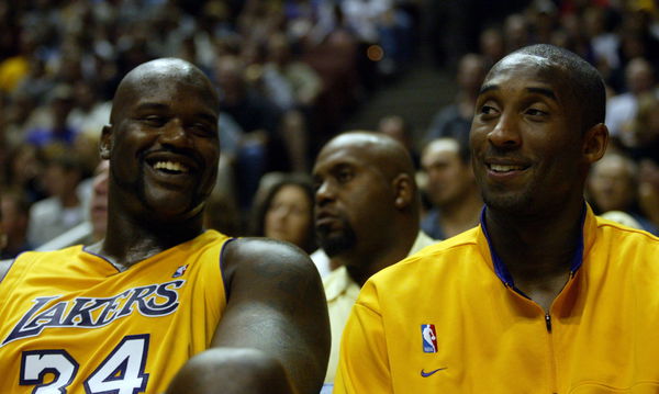 Los Angeles Lakers Shaquille O&#8217;Neal, left, shares a laugh with Kobe Bryant on the bench during a pre