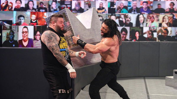 Kevin Owens attacked by Roman Reigns