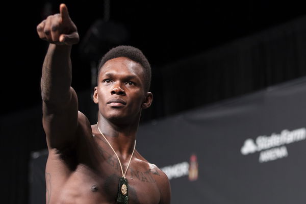 Israel Adesanya's new face and neck tattoos explained - Pulse Sports Nigeria