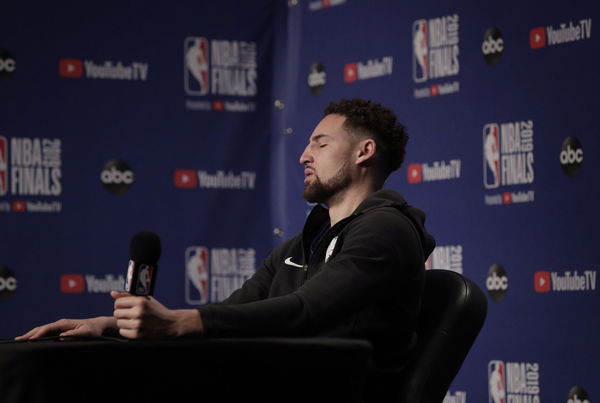 Klay Thompson (11) reacts to a question as the Golden State Warriors and Toronto Raptors practiced during an off day between Games 1 and 2 of the 2019 NBA Finals at Scotiabank Arena in Toronto, Ontario, Canada, on Saturday, June 1, 2019. The Raptors lead