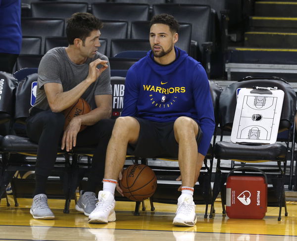 General manager Bob Myers speaks with Klay Thompson during a Golden State Warriors practice at Oracle Arena in Oakland, Calif. on Tuesday, June 4, 2019 before tomorrow&#8217;s Game 3 of the NBA Finals against the Toronto Raptors.