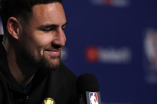 Klay Thompson smiles he listens to a reporters question during a media availability session as the Golden State Warriors and Toronto Raptors practiced before Game 5 of the 2019 NBA Finals at Scotiabank Arena in Toronto, Ontario, Canada, on Sunday, June 9,