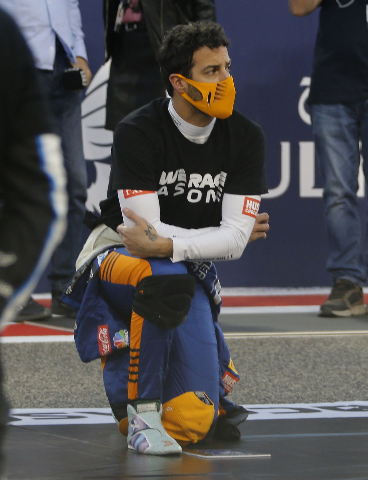 McLaren driver Daniel Ricciardo taking the knee ahead of Bahrain GP