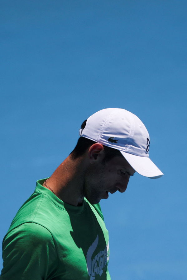 Serbian tennis player Novak Djokovic practices at Melbourne Park as questions remain over the legal battle regarding his visa to play in the Australian Open