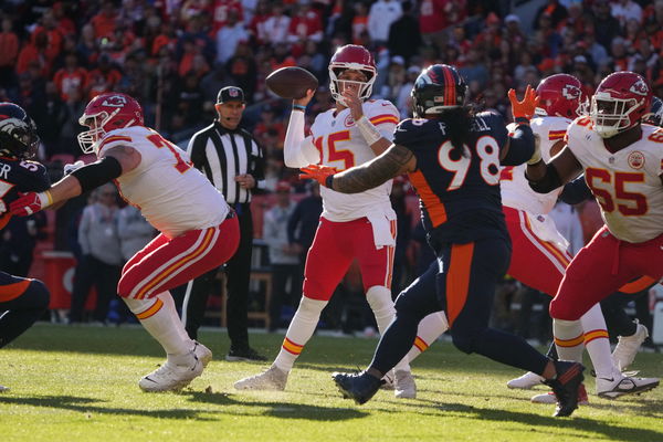 DENVER, CO - DECEMBER 11: Kansas City Chiefs quarterback Patrick Mahomes  (15) looks for a target in the first half during a game between the Kansas  City Chiefs and the Denver Broncos