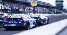 23XI Racing teammates Tyler Reddick (No. 45) and Bubba Wallace (No. 23) prepare to launch for the initial start at Indianapolis.