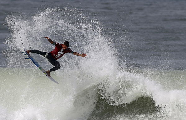 FILE PHOTO: Toledo of Brazil surfs to win his semifinal of the men&#8217;s World Surf League Rio Pro championship in Rio de Janeiro