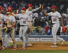 Los Angeles Angels pitcher Shohei Ohtani (17) high-fives closing pitcher Raisel Iglesias (32) after defeating the Los An