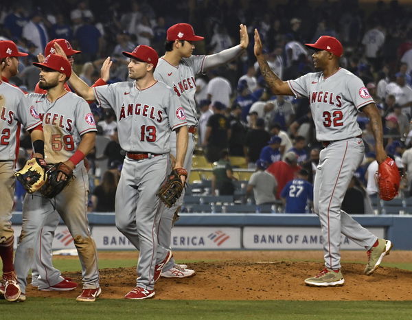 Los Angeles Angels pitcher Shohei Ohtani (17) high-fives closing pitcher Raisel Iglesias (32) after defeating the Los An