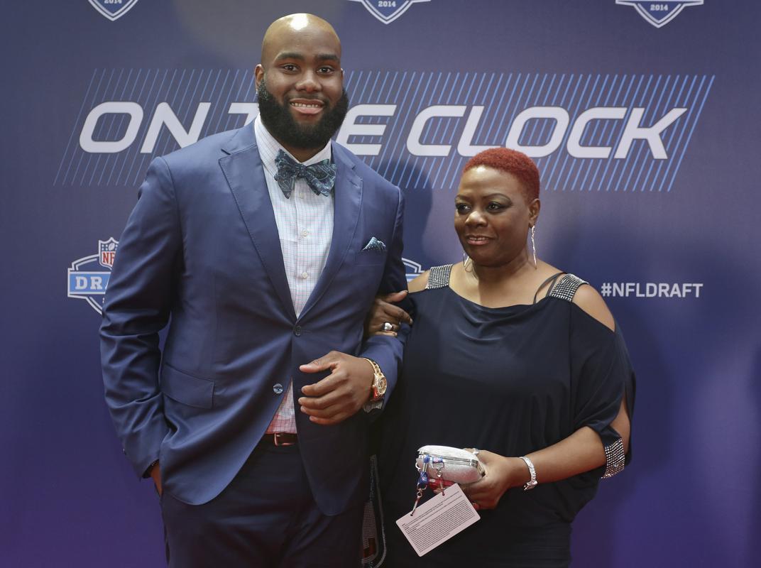 Virginia tackle Morgan Moses poses for photos with his mother Marion Graves upon arriving for the first round of the 2014 NFL Draft
