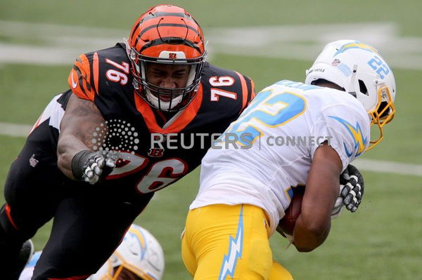 Cincinnati Bengals defensive tackle Mike Daniels (76) tackles Los Angeles Chargers running back Justin Jackson (22) in the first