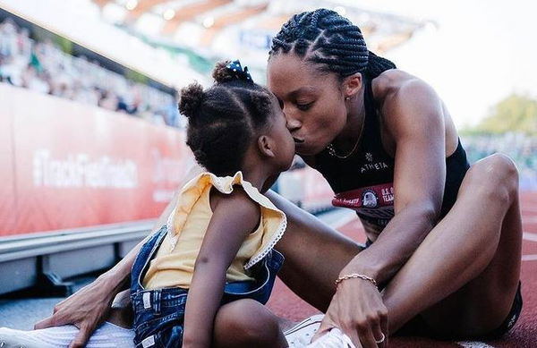 Allyson Felix with her daughter Camryn at sprinting track