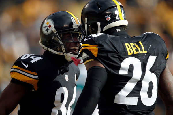 Le'Veon Bell, Adrian Peterson Face Off At Weigh-In Ahead Of Boxing Match