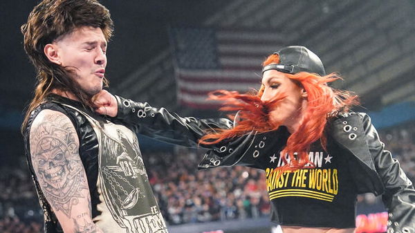 Becky Lynch punching Dominik Mysterio