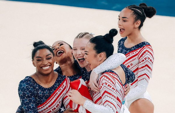 Biles celebrates with team usa Jordan Chiles, Jade Carey, Sunisa Lee, and Hezly Rivera