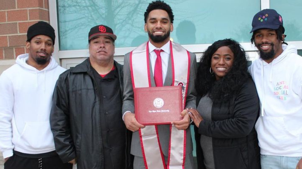 Chris Olave with his parents and brothers