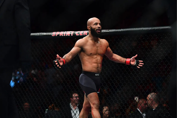 MMA: UFC Fight Night-Johnson vs Reis, 2Apr 15, 2017; Kansas City, MO, USA; Demetrious Johnson (red) celebrates following