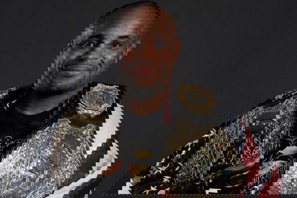 Daniel Cormier draped in US flag