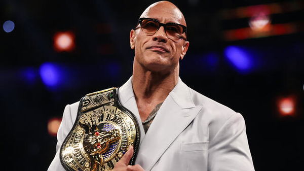 Dwayne the rock johnson receives custom belt from Lonnie Ali