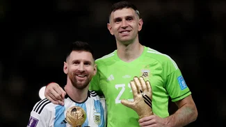 Emiliano Martinez and Lionel Messi