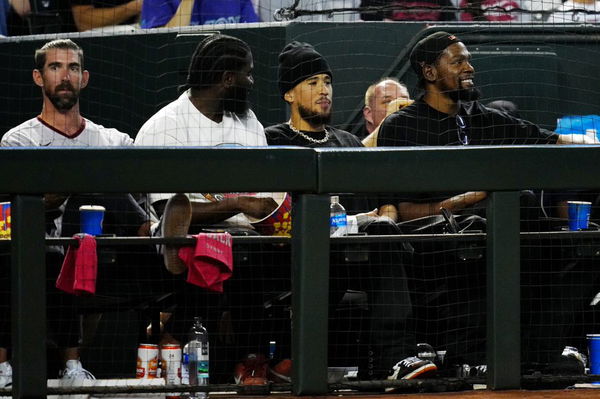 Kevin Durant and Michael Phelps watch the Arizona Diamondbacks