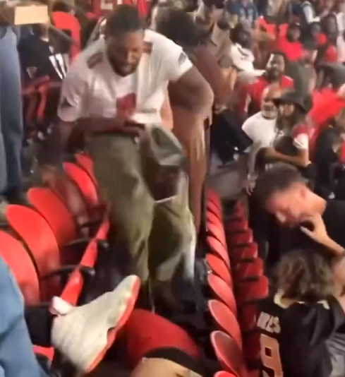 Falcons fan beating Saints fan during week 4 matchup