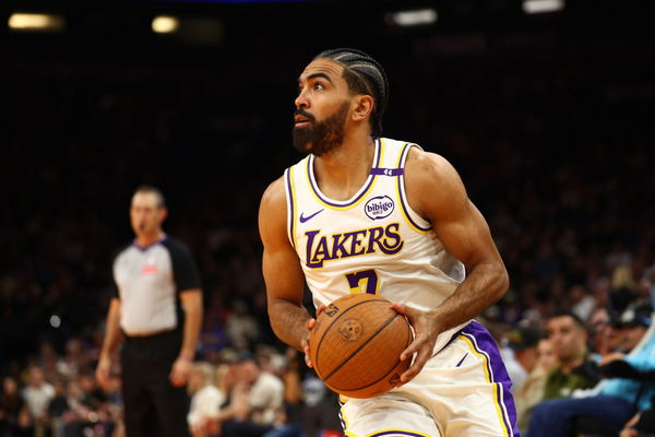 Nov 26, 2024; Phoenix, Arizona, USA; Los Angeles Lakers guard Gabe Vincent (7) against the Phoenix Suns during an NBA Cup game at Footprint Center. Mandatory Credit: Mark J. Rebilas-Imagn Images