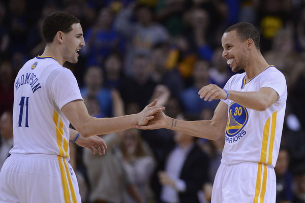 Golden State Warriors&#8217; Stephen Curry (30) is congratulated by teammate Golden State Warriors&#8217; Klay Thompson (11) after Curry sinks a three-pointer in the final minute of the game in the fourth quarter of their game at Oracle Arena in Oakland, Calif., on S