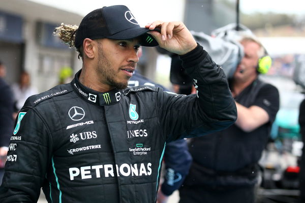 Lewis Hamilton of Mercedes AMG Petronas F1 Team  looks on at