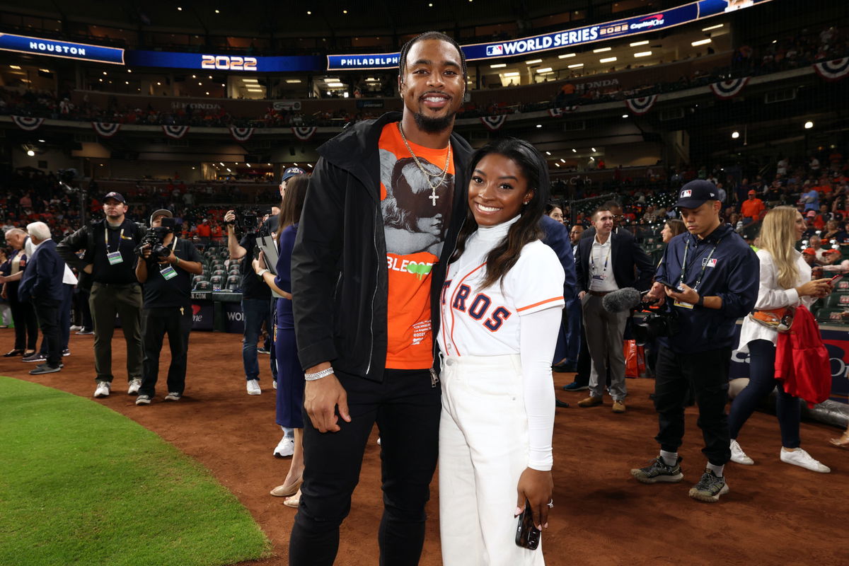 Simone Biles Wears a Red Owens Sweatshirt For Jonathan Owens