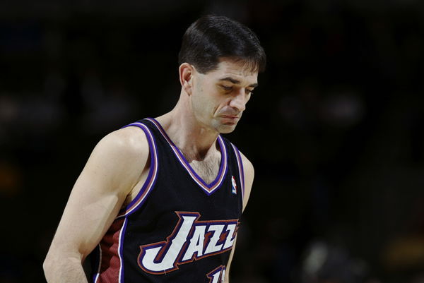 John Stockton looks on