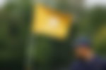 Presidents Cup flag and Xander Schauffele