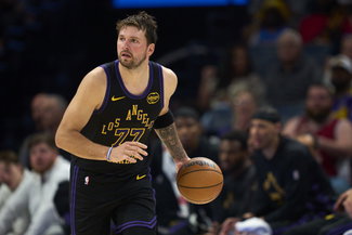 OKLAHOMA CITY, OKLAHOMA - APRIL 02: Luka Doncic #77 of the Los Angeles Lakers brings the ball up court against the Oklahoma City Thunder at the Paycom Center on April 2, 2026 in Oklahoma City, Oklahoma. NOTE TO USER: User expressly acknowledges and agrees that, by downloading and or using this photograph, User is consenting to the terms and conditions of the Getty Images License Agreement. (Photo by Cooper Neill/Getty Images)