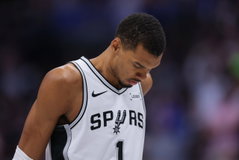 DENVER, CO - APRIL 4: Victor Wembanyama #1 of the San Antonio Spurs stands on the court with his head down during the first half against the Denver Nuggets at Ball Arena on April 4, 2026 in Denver, Colorado. NOTE TO USER: User expressly acknowledges and agrees that, by downloading and or using this photograph, User is consenting to the terms and conditions of the Getty Images License Agreement. The Nuggets won the game 136-134 in overtime. (Photo by Justin Edmonds/Getty Images)