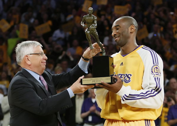 Lakers guard Kobe Bryant receives the NBA Most Valuable Player trophy from comissioner David Stern