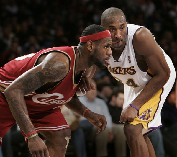 Lakers&#8217; Kobe Bryant, right, and Cleveland Cavaliers&#8217; LeBron James have their game face on.