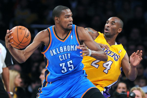 Thunders Kevin Durant drives past Lakers Kobe Bryant at the Staples Center Friday