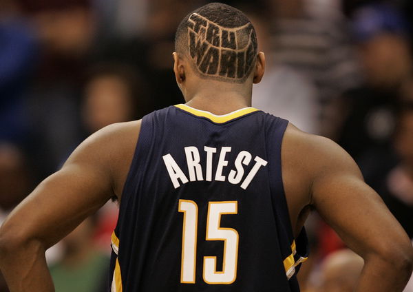 Indiana Pacers forward Ron Artest sports the phrase &#8216;Tru Warier&#8217; carved in his hair during a game a