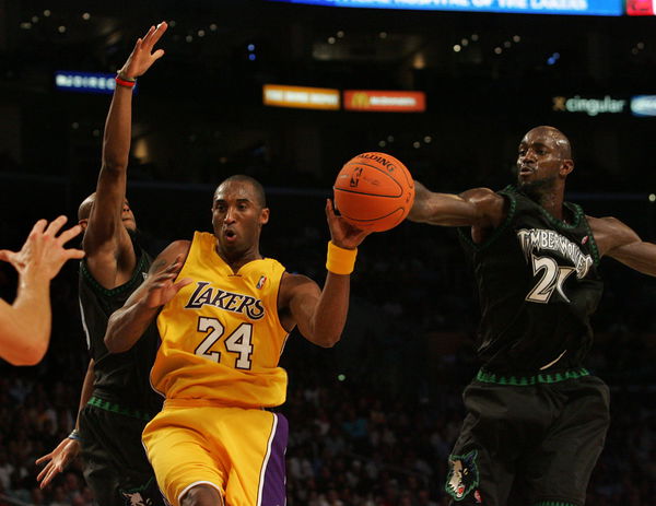 Los Angeles Lakers Kobe Bryant losses control of the ball after Minnesota Timberwolves Kevin Garnet